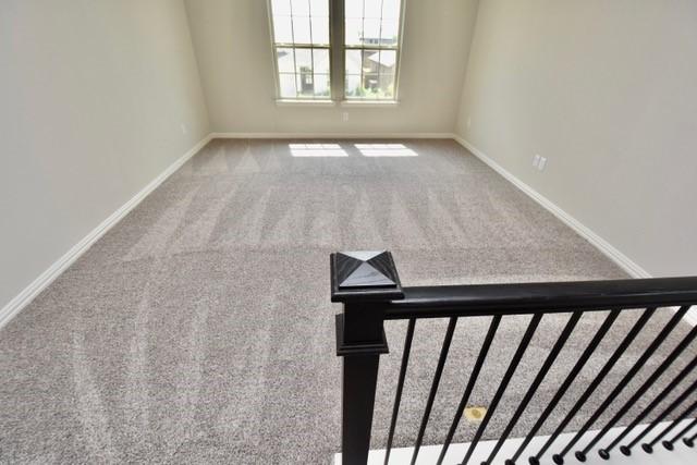 2609 Donella Dr, Denton, TX 76207 - carpeted empty room featuring baseboards