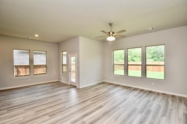 2609 Donella Dr, Denton, TX 76207 - unfurnished room with light wood-style flooring, ceiling fan, and recessed lighting