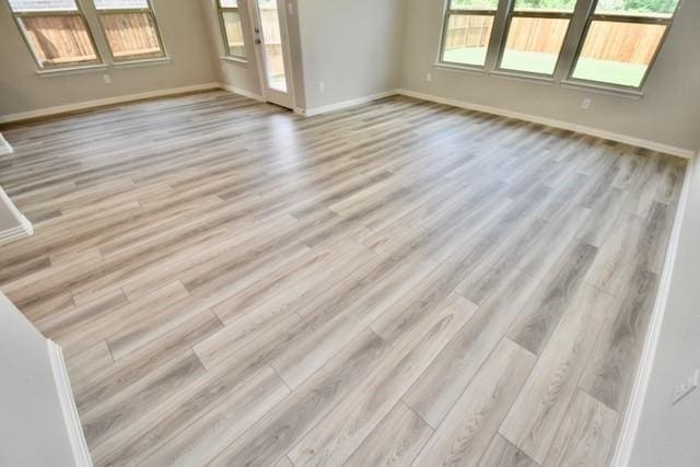 2609 Donella Dr, Denton, TX 76207 - spare room with wood finished floors and baseboards
