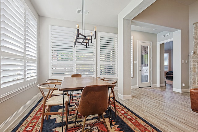 1701 Trinidad Way, Argyle, TX 76226 - dining area featuring healthy amount of natural light, a chandelier, and wood finished floors