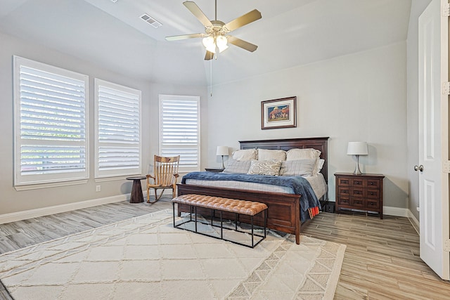 1701 Trinidad Way, Argyle, TX 76226 - bedroom featuring light wood finished floors, multiple windows, lofted ceiling, and ceiling fan