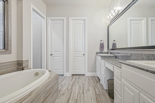 1701 Trinidad Way, Argyle, TX 76226 - bathroom with double vanity, a bath, and a closet