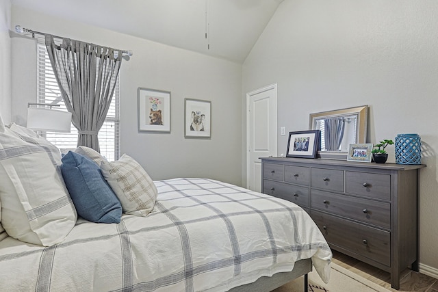1701 Trinidad Way, Argyle, TX 76226 - bedroom featuring vaulted ceiling and wood finished floors