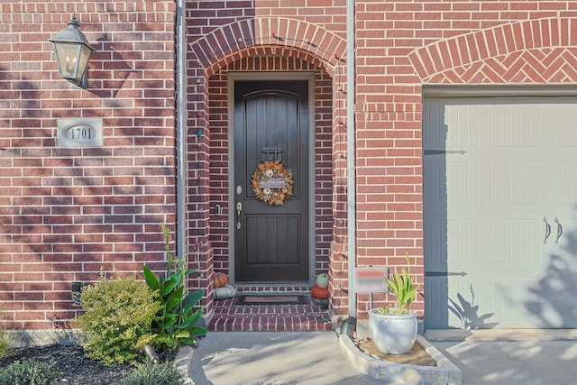 1701 Trinidad Way, Argyle, TX 76226 - view of exterior entry with brick siding and an attached garage