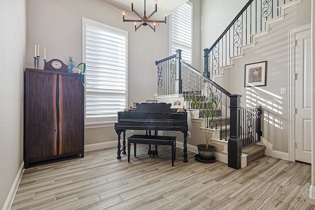 1701 Trinidad Way, Argyle, TX 76226 - living area featuring stairs, a chandelier, and light wood finished floors