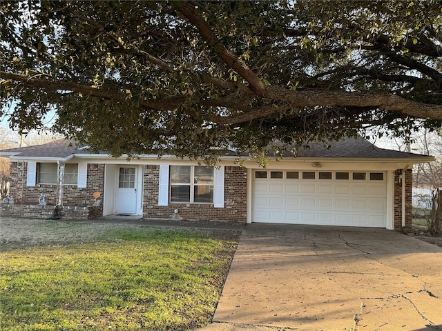 1916 11th St, Mineral Wells, TX 76067 - view of front of home featuring brick siding, concrete driveway, and a front yard