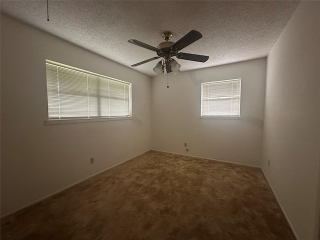 1916 11th St, Mineral Wells, TX 76067 - spare room featuring a textured ceiling, healthy amount of natural light, carpet floors, and a ceiling fan