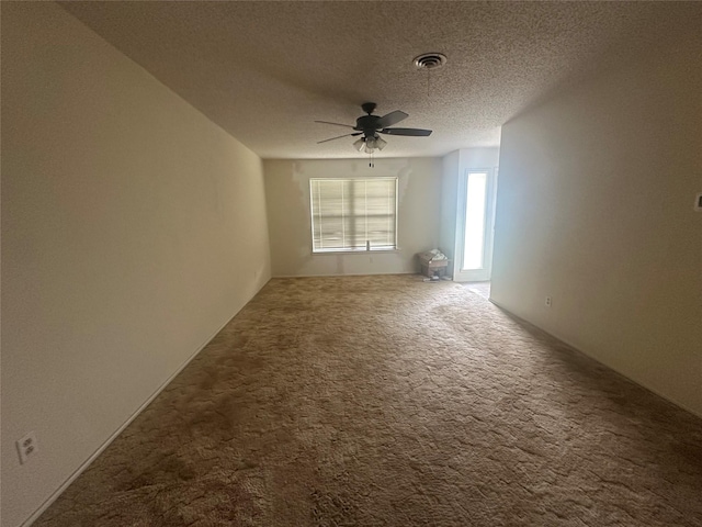 1916 11th St, Mineral Wells, TX 76067 - unfurnished room with a ceiling fan, carpet, and a textured ceiling