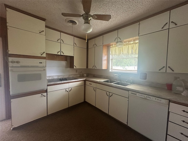 1916 11th St, Mineral Wells, TX 76067 - kitchen featuring white appliances, a textured ceiling, ceiling fan, white cabinetry, and light countertops