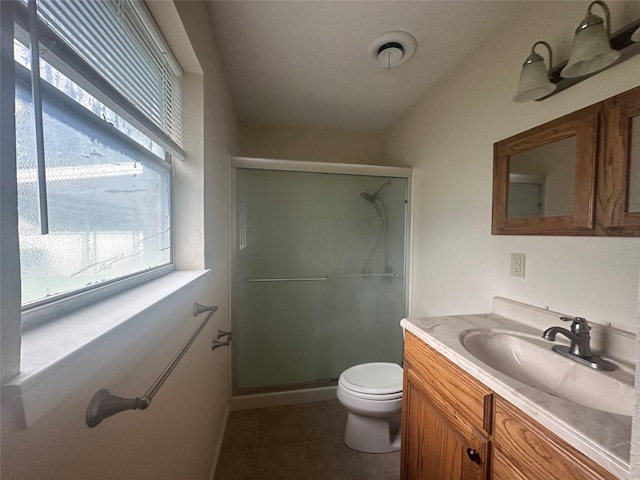 1916 11th St, Mineral Wells, TX 76067 - full bath featuring vanity, a shower stall, plenty of natural light, and tile patterned floors