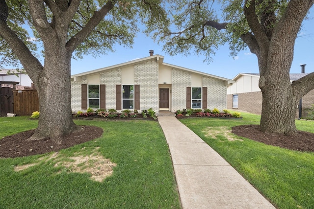 5109 Bartlett Dr, The Colony, TX 75056 - mid-century modern home featuring brick siding