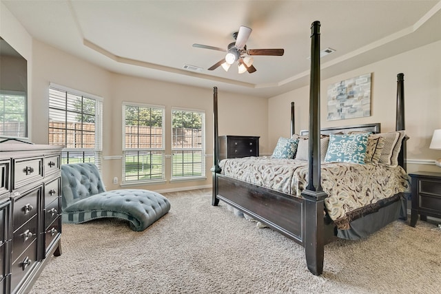 1220 Glendon Dr, Forney, TX 75126 - bedroom featuring a tray ceiling, carpet, and a ceiling fan