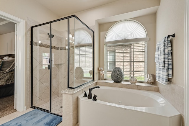 1220 Glendon Dr, Forney, TX 75126 - bathroom featuring a whirlpool tub, a stall shower, and tile patterned floors