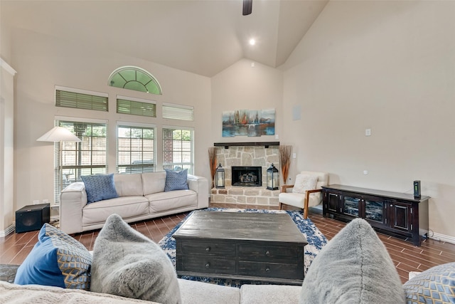 1220 Glendon Dr, Forney, TX 75126 - living room with high vaulted ceiling, a stone fireplace, ceiling fan, and wood finish floors