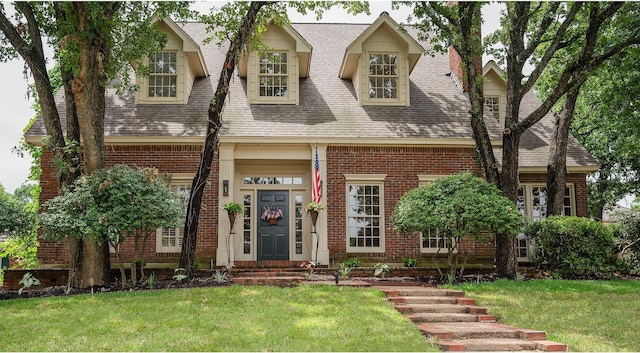 5906 Tiffany Ct, Arlington, TX 76016 - view of front facade with brick siding, a shingled roof, and a front yard