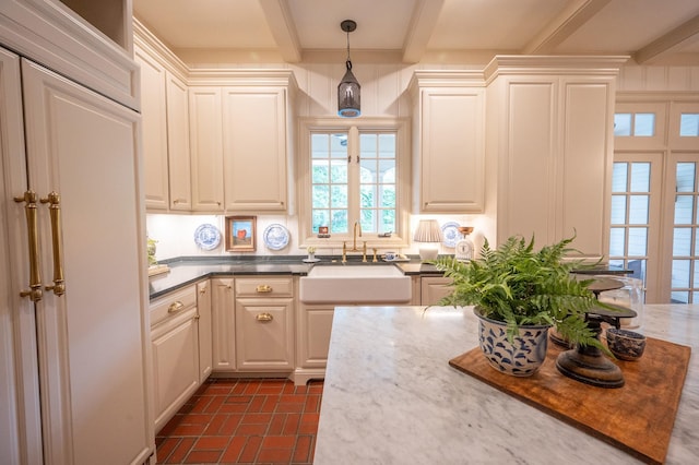 5906 Tiffany Ct, Arlington, TX 76016 - kitchen featuring beamed ceiling, brick patterned flooring, and decorative light fixtures