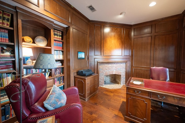 5906 Tiffany Ct, Arlington, TX 76016 - office area with wood finished floors, a brick fireplace, and built in shelves