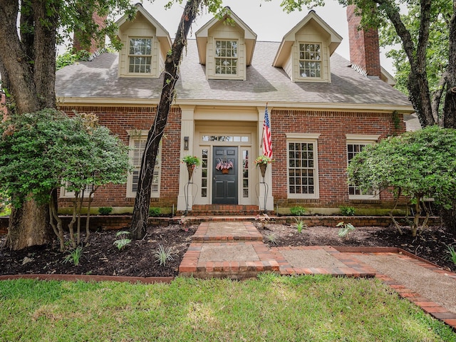 5906 Tiffany Ct, Arlington, TX 76016 - view of front of home with brick siding, a chimney, and a shingled roof