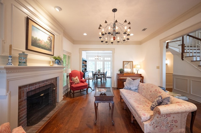 5906 Tiffany Ct, Arlington, TX 76016 - living area with a chandelier, stairway, wood finished floors, crown molding, and a fireplace