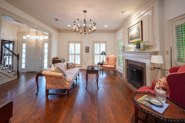5906 Tiffany Ct, Arlington, TX 76016 - living area with a chandelier, stairs, dark wood-style floors, a brick fireplace, and ornamental molding