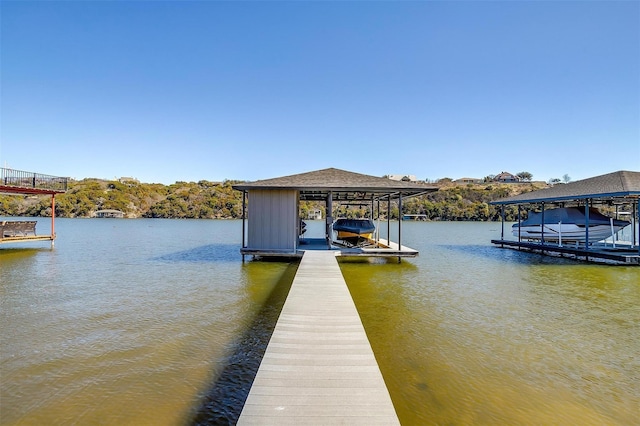 1204 E Scandinavian Ct, Granbury, TX 76048 - dock area featuring boat lift and a water view