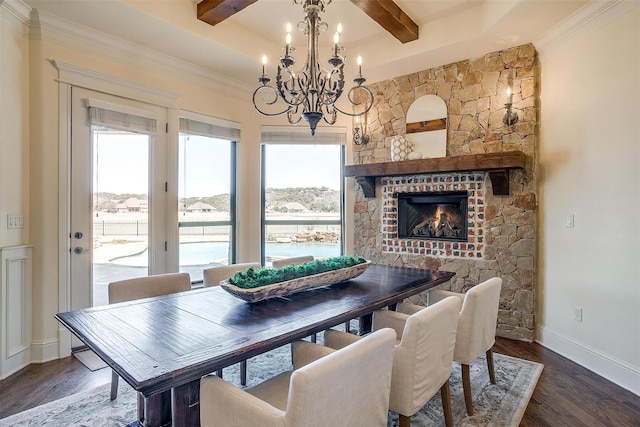 1204 E Scandinavian Ct, Granbury, TX 76048 - dining room featuring beamed ceiling, a chandelier, wood finished floors, and a fireplace