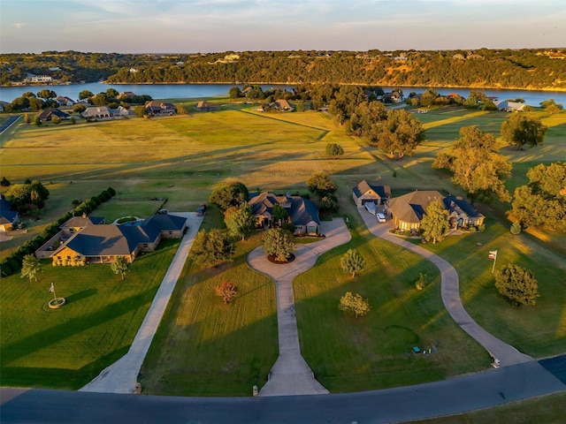 1204 E Scandinavian Ct, Granbury, TX 76048 - aerial view at dusk of a water view and a residential view