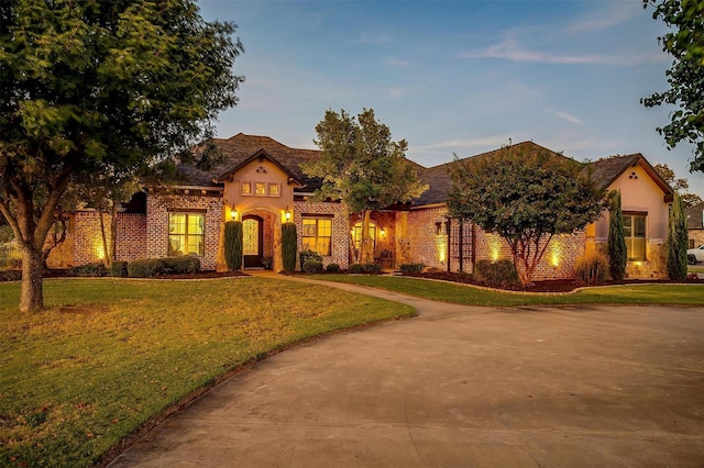 1204 E Scandinavian Ct, Granbury, TX 76048 - view of front facade featuring a front yard and brick siding
