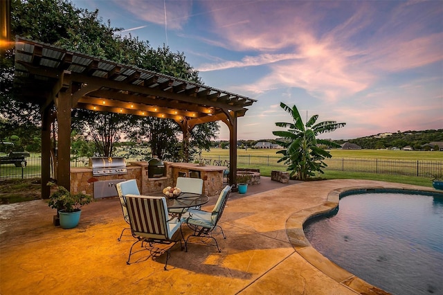 1204 E Scandinavian Ct, Granbury, TX 76048 - view of patio / terrace with an outdoor kitchen, a pergola, and outdoor dining space