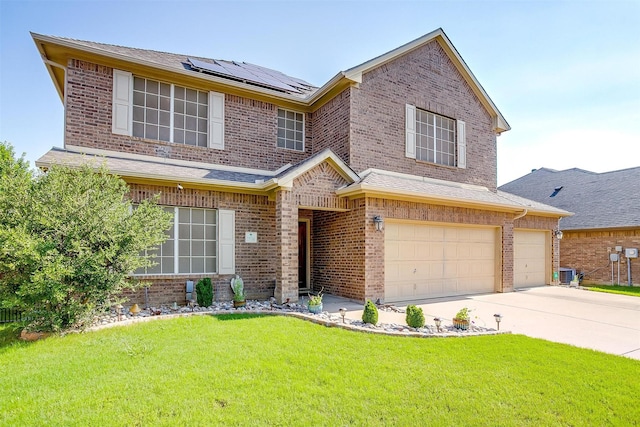 2536 Glenn Ranch Dr, Burleson, TX 76028 - view of front facade featuring brick siding, solar panels, a front lawn, driveway, and an attached garage