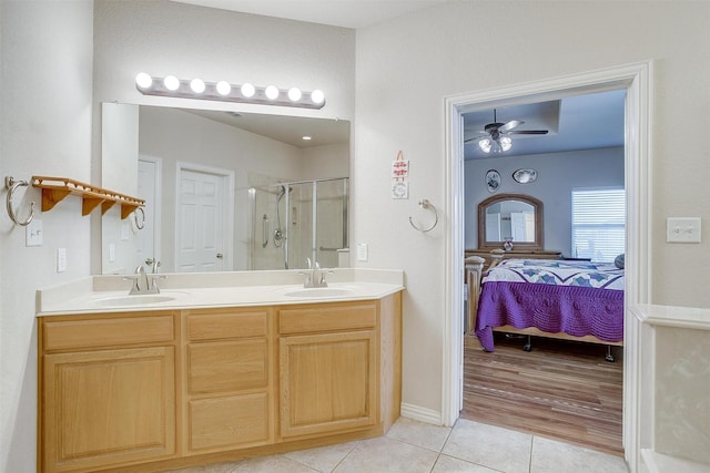 2536 Glenn Ranch Dr, Burleson, TX 76028 - full bathroom with tile patterned floors, ensuite bath, a shower stall, double vanity, and a ceiling fan