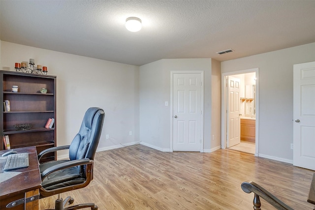 2536 Glenn Ranch Dr, Burleson, TX 76028 - home office featuring light wood-type flooring and a textured ceiling