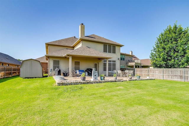 2536 Glenn Ranch Dr, Burleson, TX 76028 - rear view of house with a shed, a fenced backyard, a patio area, and a chimney