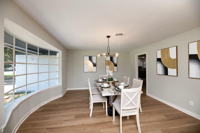 6817 Yolanda Dr, Fort Worth, TX 76112 - dining room with light wood finished floors and a chandelier