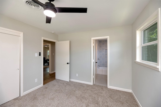 6817 Yolanda Dr, Fort Worth, TX 76112 - unfurnished bedroom featuring carpet, connected bathroom, and a ceiling fan