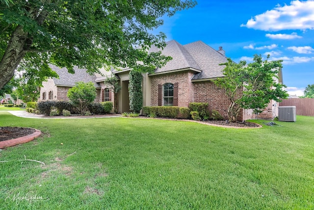 902 Blair Xing, Bossier City, LA 71111 - french country home with brick siding, roof with shingles, and a chimney