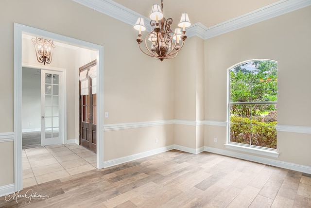 902 Blair Xing, Bossier City, LA 71111 - spare room featuring a chandelier, wood finished floors, ornamental molding, and french doors
