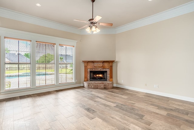 902 Blair Xing, Bossier City, LA 71111 - unfurnished living room featuring light wood-style floors, ceiling fan, crown molding, and a brick fireplace
