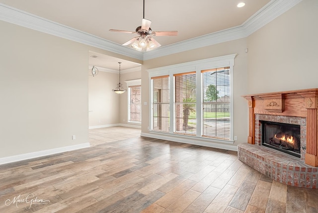 902 Blair Xing, Bossier City, LA 71111 - unfurnished living room featuring light wood finished floors, a ceiling fan, a fireplace, crown molding, and recessed lighting