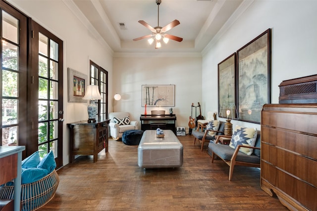 4263 Veneto Dr, Frisco, TX 75033 - living area featuring dark wood-style floors, ceiling fan, a raised ceiling, and crown molding