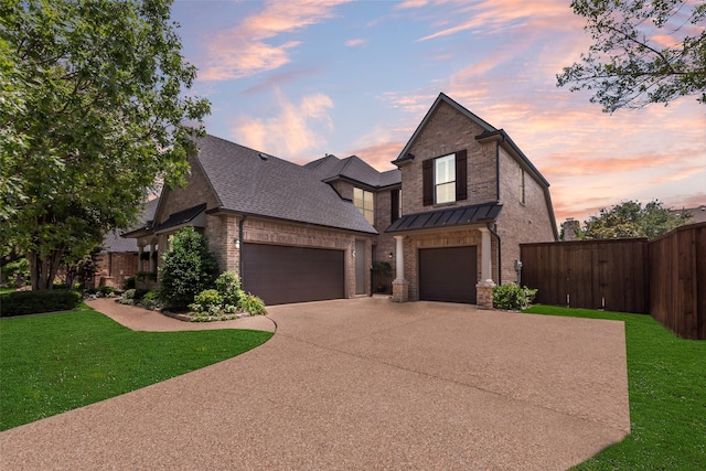 4263 Veneto Dr, Frisco, TX 75033 - view of front of house with driveway, brick siding, roof with shingles, and a standing seam roof