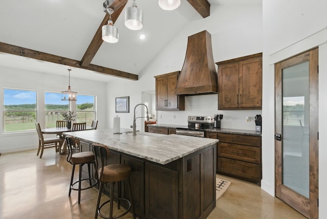 170 La Cresta Ln, Mineral Wells, TX 76067 - kitchen with stainless steel range with electric cooktop, custom exhaust hood, finished concrete floors, beam ceiling, and an island with sink