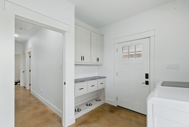 170 La Cresta Ln, Mineral Wells, TX 76067 - washroom with separate washer and dryer, attic access, and cabinet space