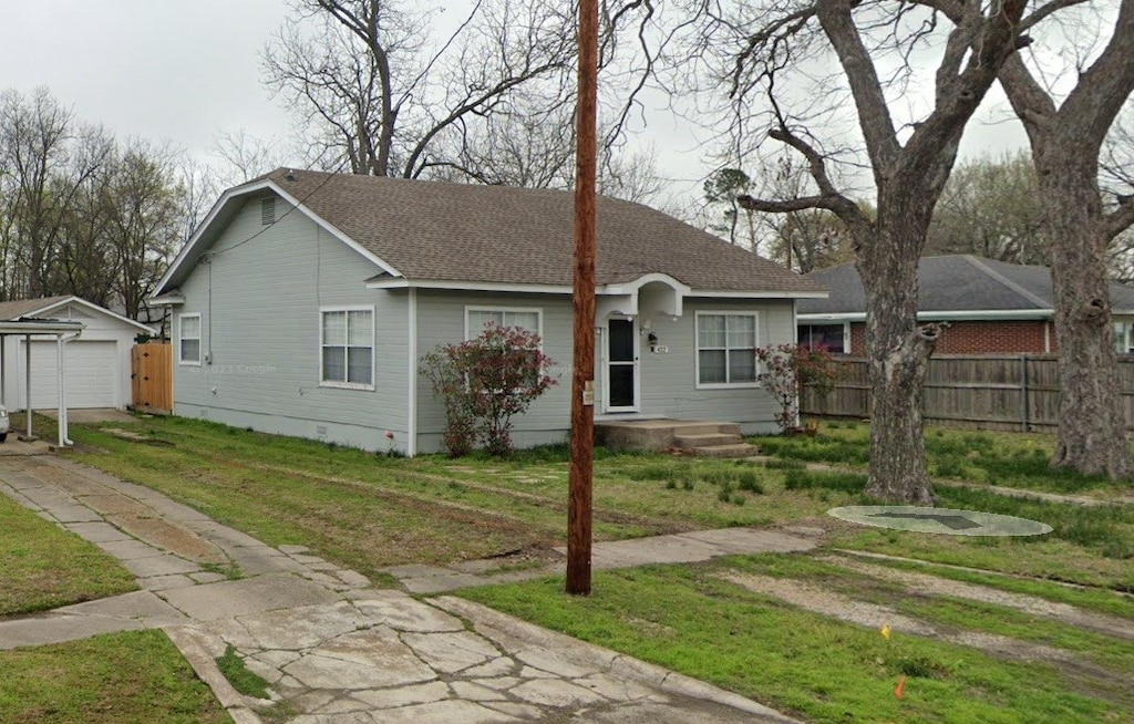 422 W High St, Wills Point, TX 75169 - ranch-style home featuring an outdoor structure, crawl space, concrete driveway, a garage, and roof with shingles