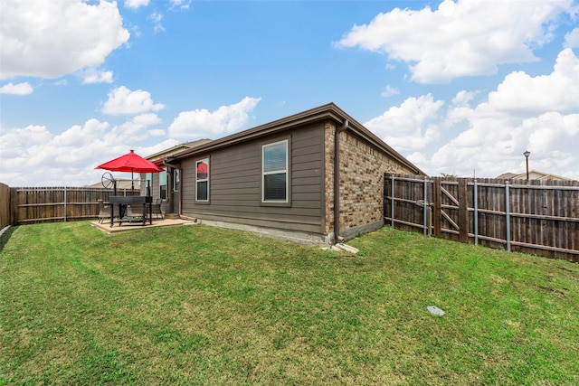 901 Opal Path, Princeton, TX 75407 - back of house with brick siding, a fenced backyard, and a patio area