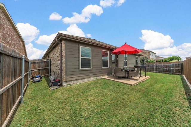 901 Opal Path, Princeton, TX 75407 - rear view of house with a fenced backyard, brick siding, and a patio area