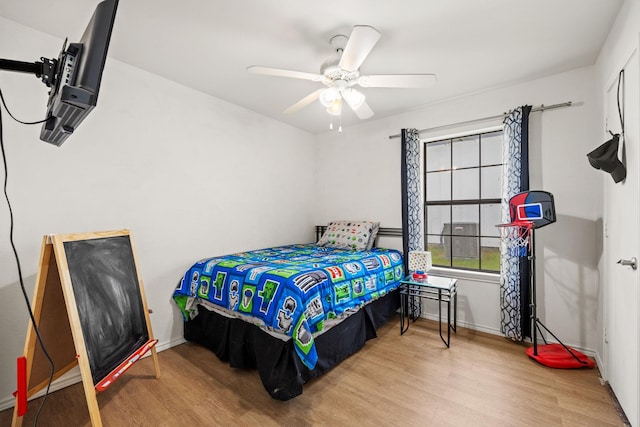 803 Melody Cir, Kaufman, TX 75142 - bedroom with wood finished floors and a ceiling fan
