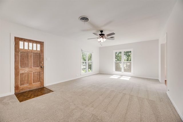 103 E 14th St, Joshua, TX 76058 - carpeted entryway with baseboards and a ceiling fan
