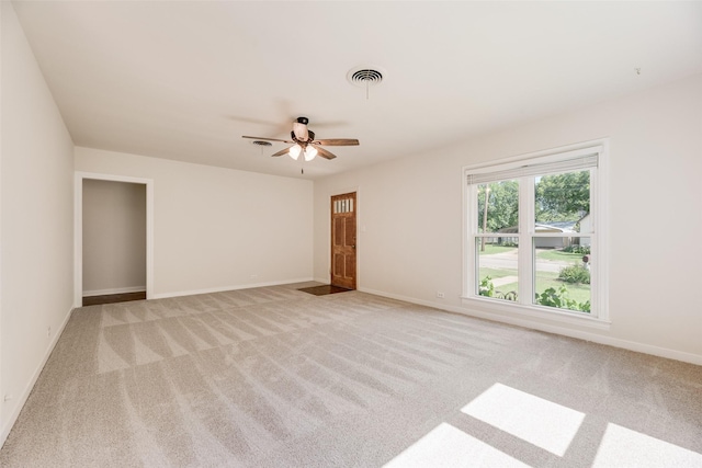 103 E 14th St, Joshua, TX 76058 - empty room with light colored carpet and a ceiling fan