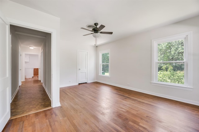 103 E 14th St, Joshua, TX 76058 - unfurnished room with wood finished floors and a ceiling fan